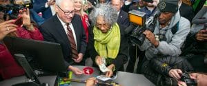 Alyce Clark buying her first scratch-off ticket as sales opened up in Mississippi